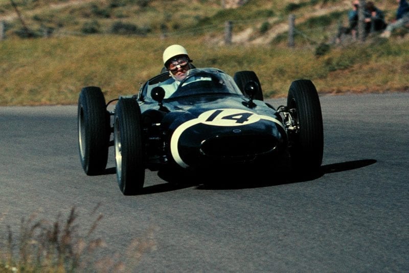 Stirling Moss driving a Lotus 18 to 4th place.