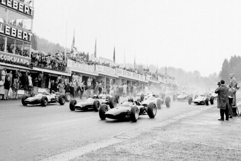 Graham Hill (BRM P57), Dan Gurney (Brabham BT7 Climax) and Willy Mairesse (Ferrari 156) lead at the start of the race.