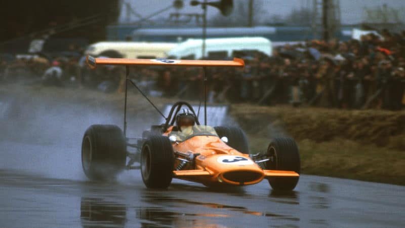 Denny Hulme (McLaren-Ford) in the wet 1969 non-championship International Trophy race at Silverstone. Photo: Grand Prix Photo