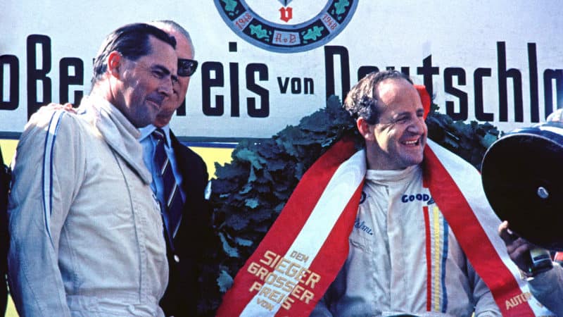 Denny Hulme and Jack Brabham (both Brabham-Repco) on the podium after the 1967 German Grand Prix at the Nurburgring. Photo: Grand Prix Photo