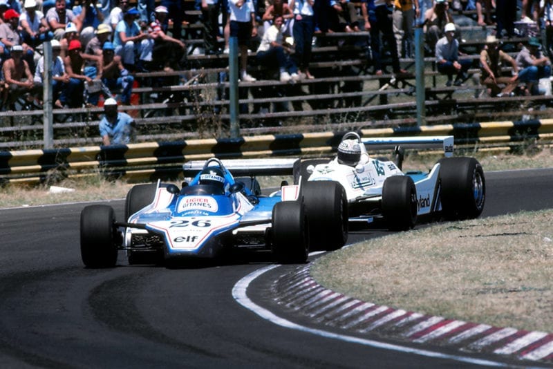 Jacques Laffite, in a Ligier JS11/15 ahead of eventual race winner Alan Jones driving a Williams FW07.