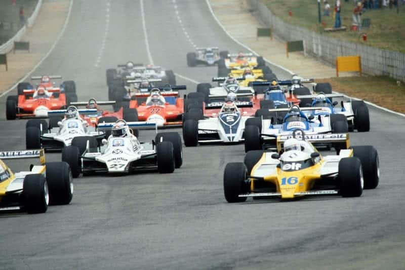 First corner and Jean-Pierre Jabouille (Renault) just out of the picture, is followed by eventual winner Rene Arnoux also Renault, right and Alan Jones (Williams).