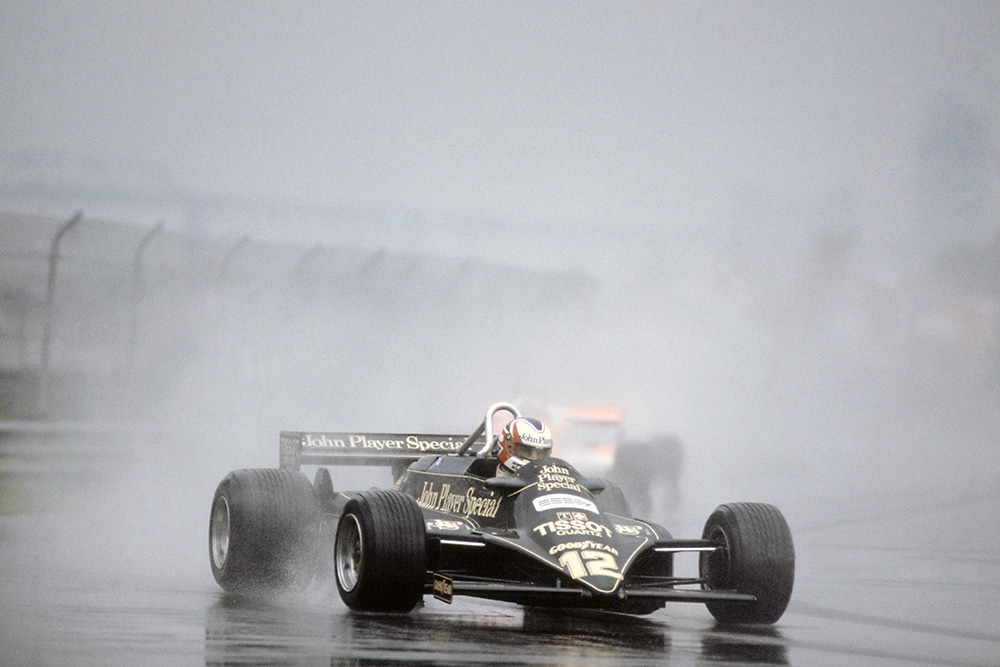 Nigel Mansell in a Lotus 87-Ford Cosworth, he later retired.