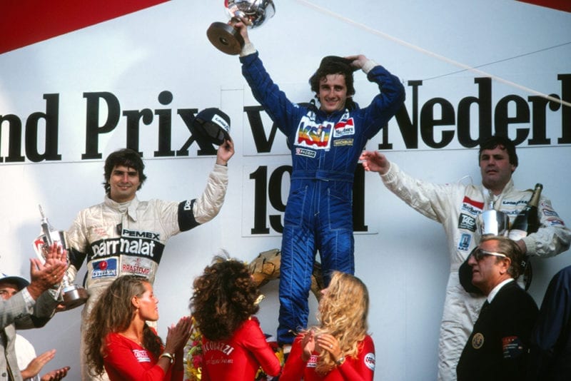 On the podium, 1st Alain Prost (Renault), 2nd Nelson Piquet (Brabham), left.3rd Alan Jones (Williams) right.