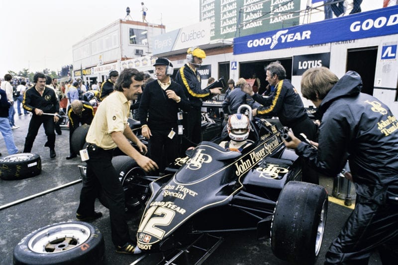 Nigel Mansell's Lotus 91-Ford in the pit lane.