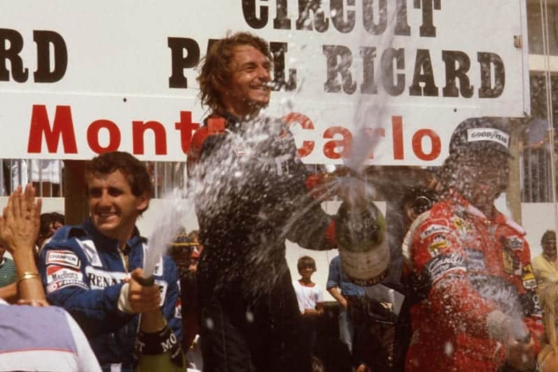 Rene Arnoux, 1st position, Alain Prost, 2nd position and Didier Pironi, 3rd position on the podium.