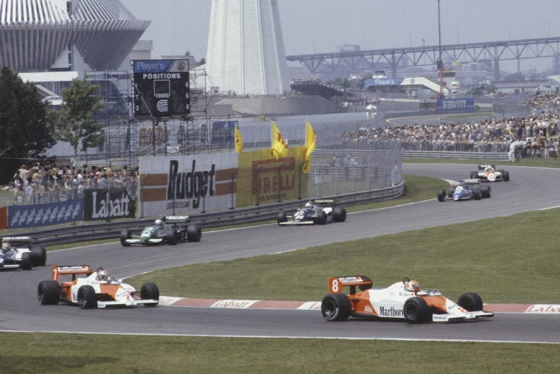 Niki Lauda (McLaren MP4-1C Ford), leads team-mate John Watson, Roberto Guerrero (Theodore N183 Ford), Danny Sullivan (Tyrrell 011 Ford), Johnny Cecotto (Theodore N183 Ford), Raul Boesel (Ligier JS21 Ford), and Mauro Baldi, (Alfa Romeo 183T).