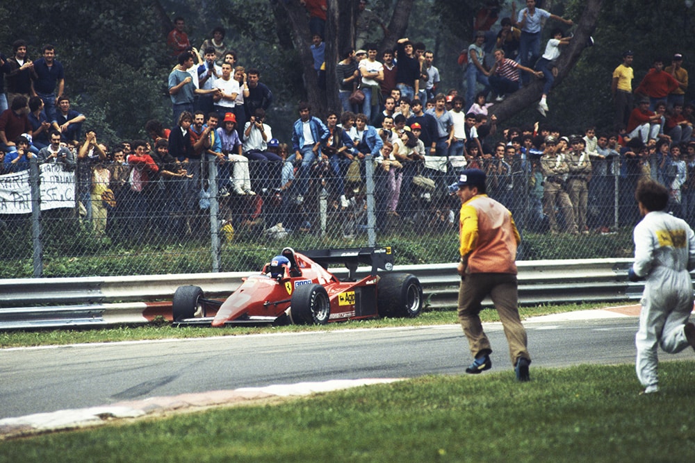 Marshals run to the assistance of Patrick Tambay after a spin.