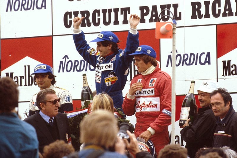 Alain Prost, 1st position, Nelson Piquet 2nd position and Eddie Cheever, 3rd position on the podium.