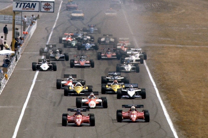 Patrick Tambay and Rene Arnoux (both Ferrari 126C3's) lead Andrea de Cesaris (Alfa Romeo 183T) and Nelson Piquet (Brabham BT52B BMW), Alain Prost and Eddie Cheever (both Renault RE40's) at the start.