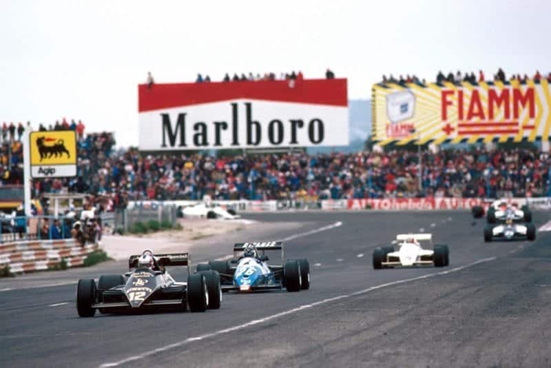 Nigel Mansell's Lotus leads the Ligier of Jean-Pierre Jarier.