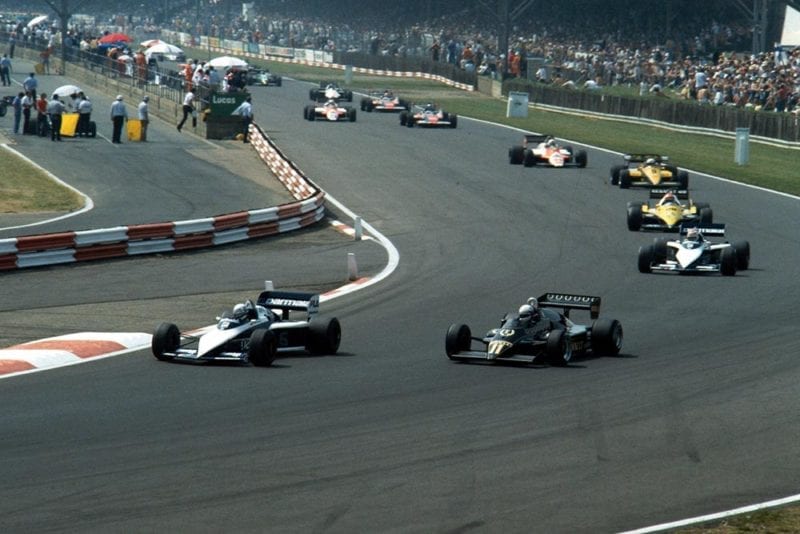 The Brabham of Riccardo Patrese, followed by the Lotus of Elio de Angelis.