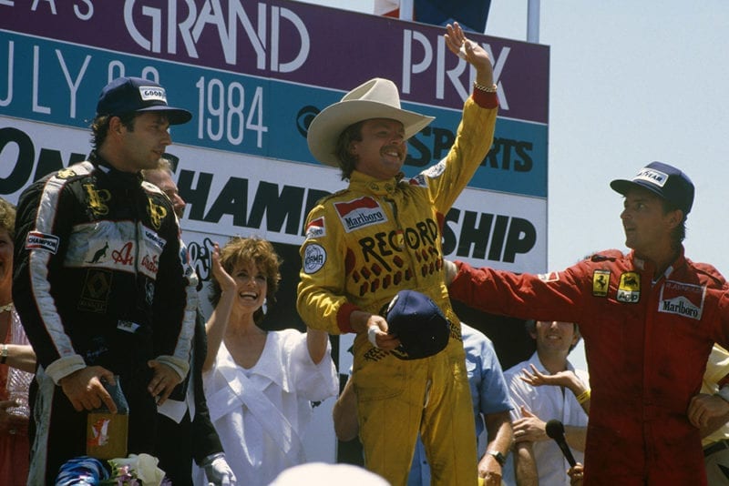 Keke Rosberg, 1st position, Elio de Angelis, 2nd position and Rene Arnoux, 3rd position on the podium.