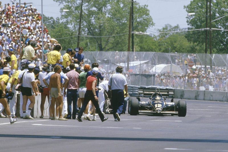 Nigel Mansell (Lotus 95T Renault) near to exhaustion, glanced a wall heavily and damaged the gear selectors on his car. He came to a standstill, then heroicly pushed his car to the line to eventually finish in sixth position.
