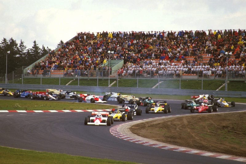 Alain Prost (McLaren MP42 TAG Porsche) leads Patrick Tambay (Renault RE50), Nelson Piquet (Brabham BT53 BMW) and Derek Warwick (Renault RE50) at the start. Others lock up coming into the Castrol-S as Ayrton Senna (Toleman TG184 Hart) crashes into Keke Rosberg (Williams FW09B Honda).