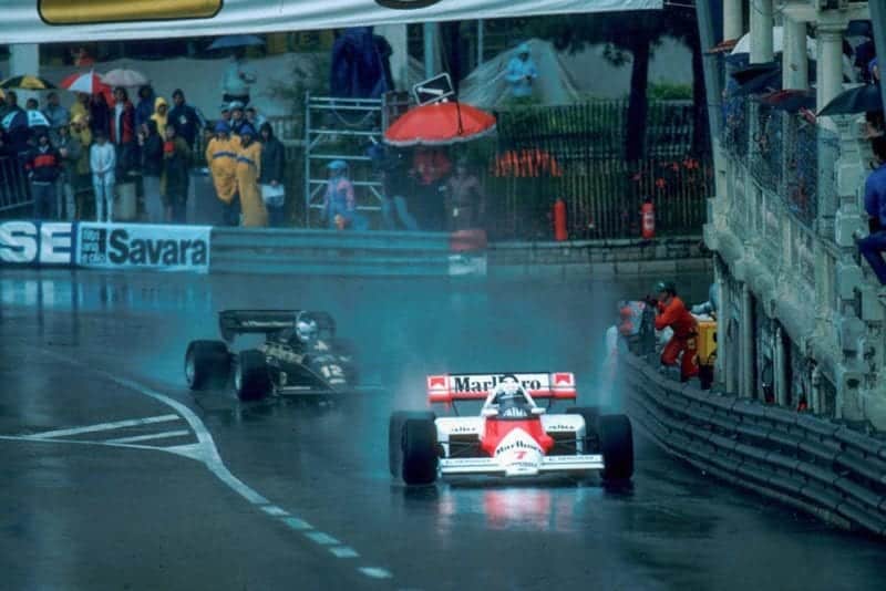 Winner Alain Prost McLaren MP4/2 leads a Lotus.