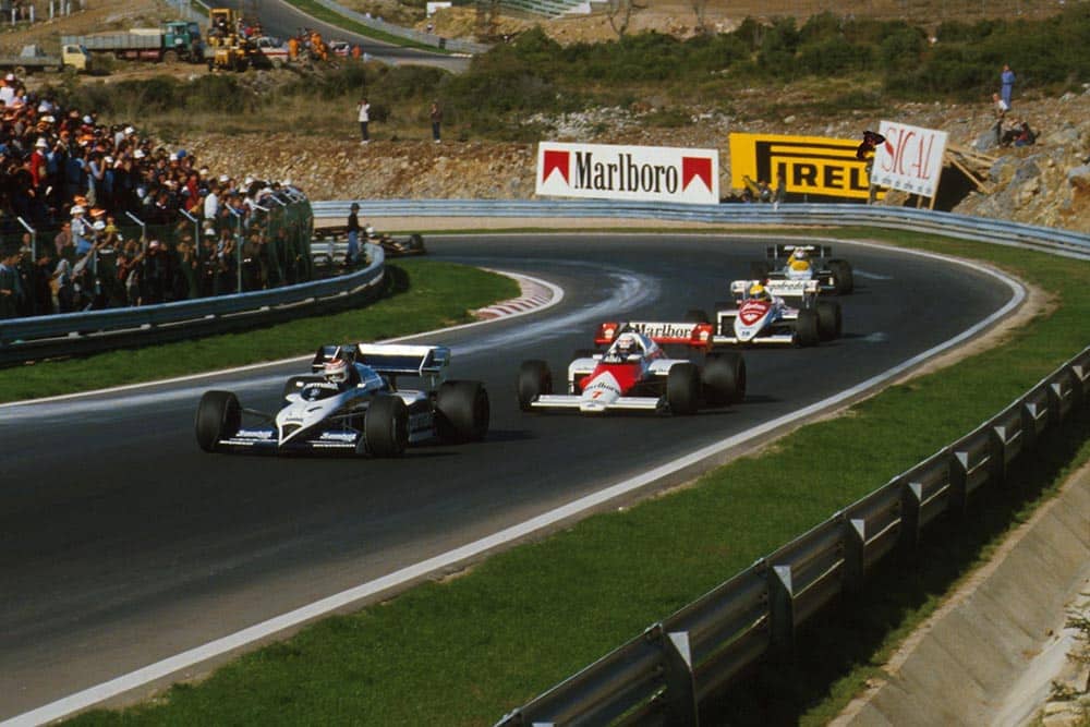 Nelson Piquet is chased by race winner Alain Prost and Ayrton Senna.