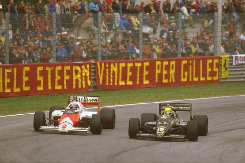 Alain Prost (McLaren MP4/2B TAG Porsche) battles with Ayrton Senna (Lotus 97T Renault) on the way to 1st position.