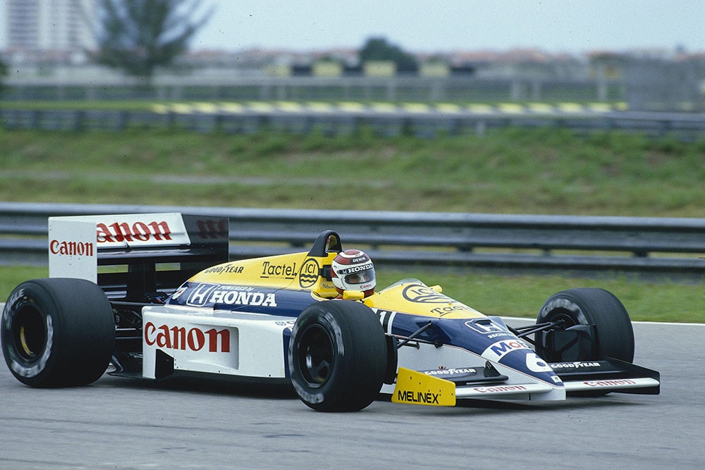 Nelson Piquet at the heel of his Williams FW11 Honda.