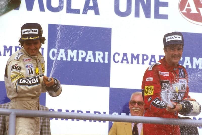 Nelson Piquet, 1st position with teammate Nigel Mansell, 3rd, on the podium.