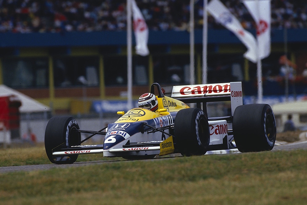 Nelson Piquet in first place in his Williams FW11 Honda.