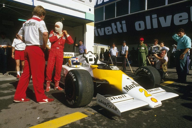 Keke Rosberg and his McLaren MP4/2C TAG Porsche in the pits.