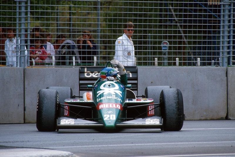Gerhard Berger sits beside the track in his Benetton BMW4.