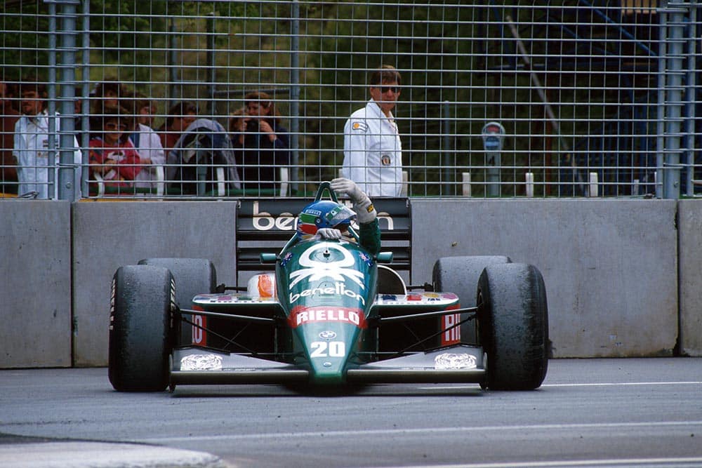 Gerhard Berger sits beside the track in his Benetton BMW4.