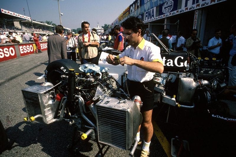 The Tyrrell mechanics set to work on their engines.