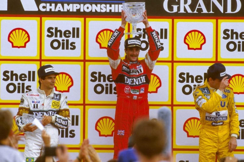 Nigel Mansell, 1st position, Nelson Piquet, 2nd, and Ayrton Senna, 3rd on the podium.