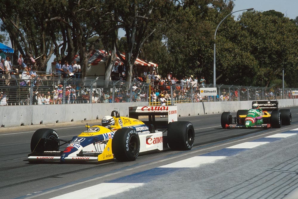 Ricardo Patrese, Williams FW11B, replaced the injured Nigel Mansell and was classified ninth, despite spinning out late in the race. He leads Teo Fabi's Benetton B187.