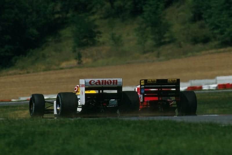 Nelson Piquet, Williams FW11B, and Gerhard Berger, Ferrari F1/87, battle.