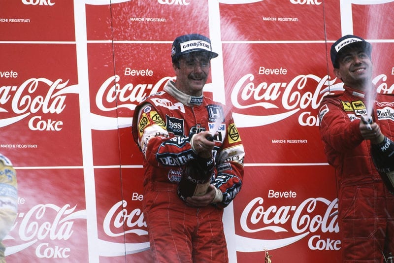 Race winner Nigel Mansell sprays the Champagne with third placed Michele Alboreto.
