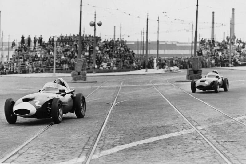 Stirling Moss in a Vanwall VW10 leads Stuart Lewis-Evans in his Vanwall VW6.