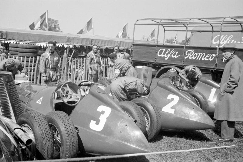 Alfa Romeo cars in the paddock ahead of the 1950 British Grand Prix