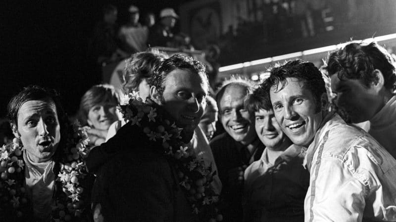 Mario Andretti, Nino Vaccarella, Ignazio Giunti, 12 Hours of Sebring, Sebring, 21 March 1970. An ecstatic Mario Andretti after his stupendous win in the 1970 12 Hours of Sebring (the greatest of his racing career, by his own admission), here win teammates Nino Vaccarella and Ignacio Giunti. (Photo by Bernard Cahier/Getty Images)