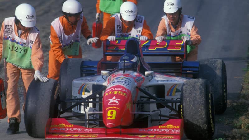 Arrows of Taki Inoue is pushed by marshals at the 1995 French Grand Prix