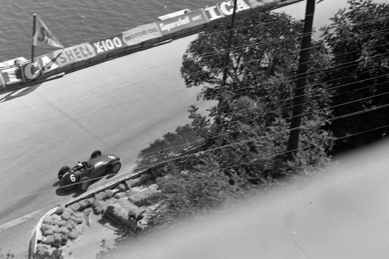 Jean Behra drives past the harbour in his BRM.