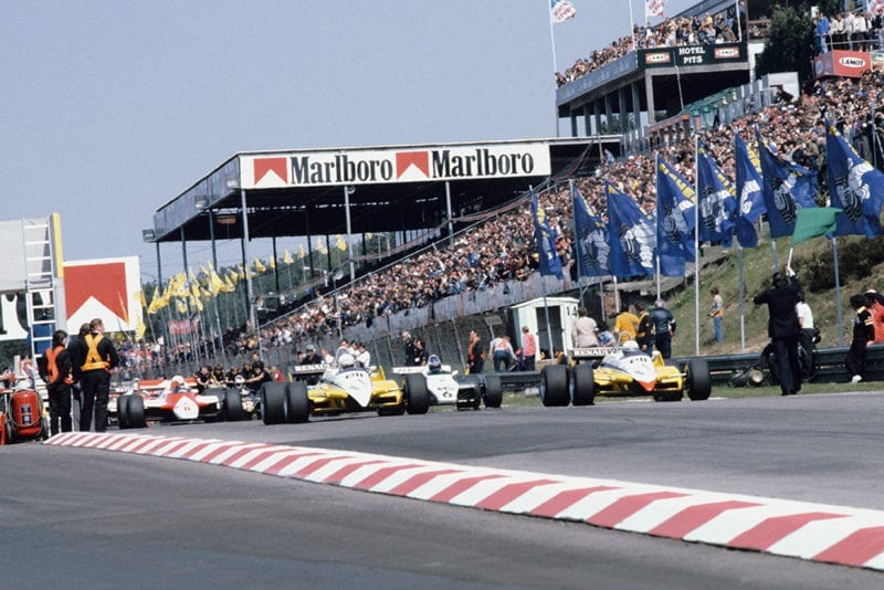 Rene Arnoux (Renault RE30B) leads Keke Rosberg (Williams FW08 Ford), Alain Prost (Renault RE30B), Niki Lauda and John Watson (both McLaren MP4/1B Ford's) and Michele Alboreto (Tyrrell 011 Ford) at the start.