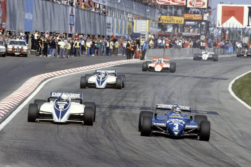 Michele Alboret in his Tyrrell 011-Ford leads Riccardo Patrese (Brabham BT50-BMW), Nelson Piquet (Brabham BT50-BMW), John Watson (McLaren MP4/1B-Ford), Derek Daly (Williams FW08-Ford) and Elio de Angelis (Lotus 91-Ford).