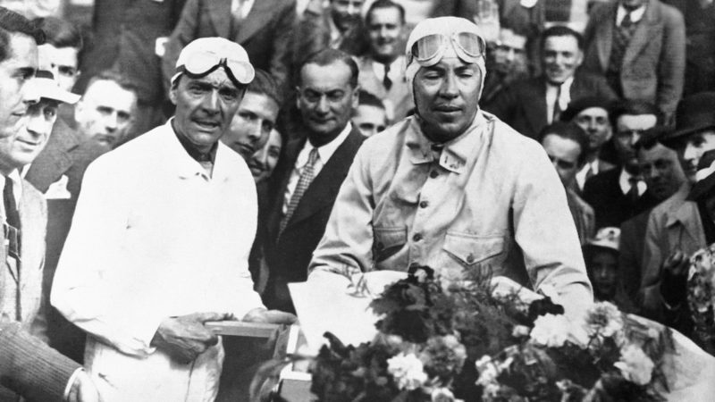 FRANCE - JANUARY 18: The racing drivers Robert BENOIST and Jean-Pierre WIMILLE receive flowers for their victory at the 24h of Le Mans, on June 20, 1937. (Photo by Keystone-France/Gamma-Keystone via Getty Images)