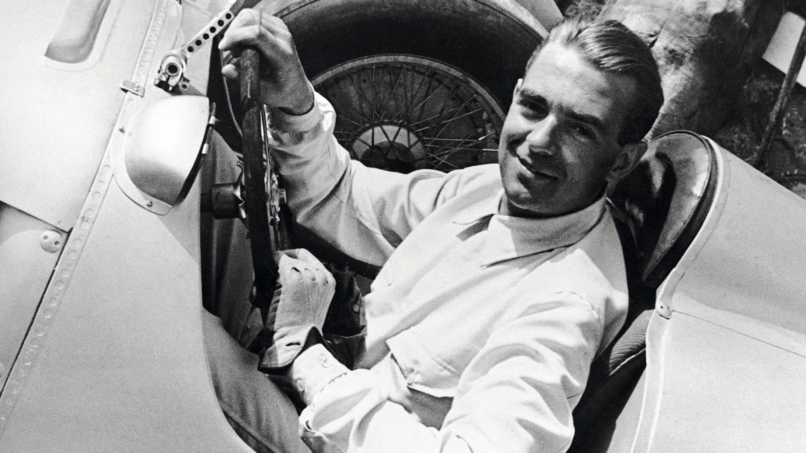 Bernd Rosemeyer in the cockpit of his car in 1936