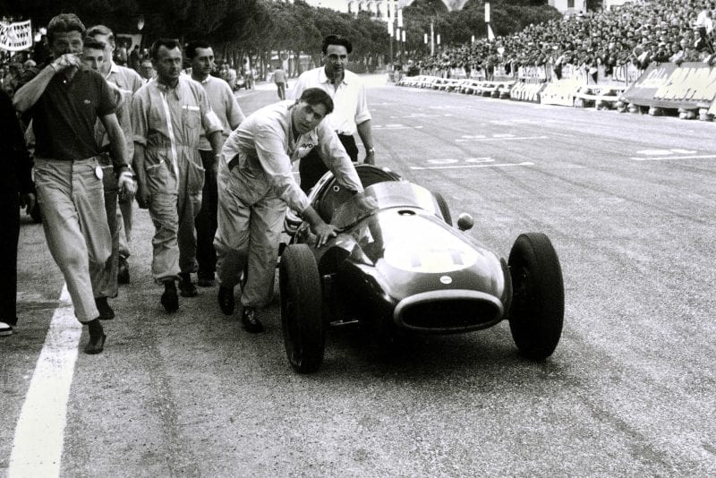 Jack Brabham pushes his Cooper across the finish line at the 1957 Monaco Grand Prix.
