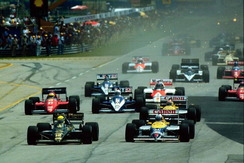 Ayrton Senna just leads Nigel Mansell.