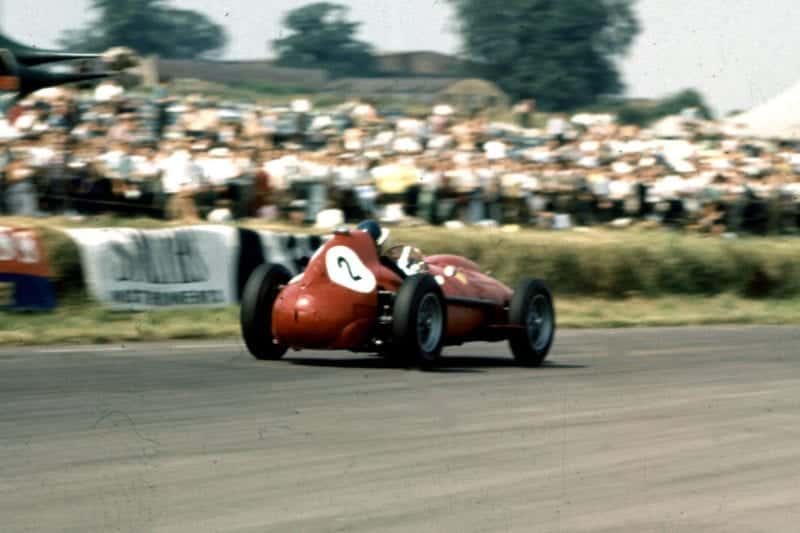 Mike Hawthorn piloting his Ferrari Dino 246 to 2nd place.