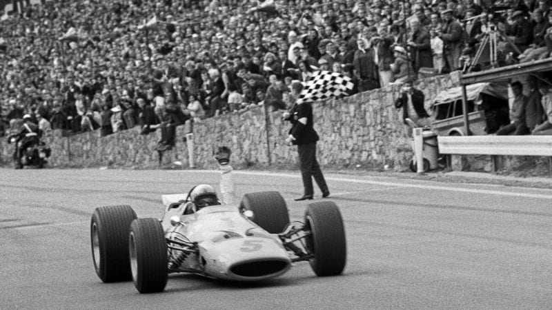 Bruce McLaren crosses the line at Spa Francorchamps to win the 1968 F1 Belgian Grand prix