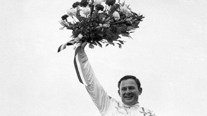 Bruce McLaren on the podium after winning the 1968 Belgian Grand Prix