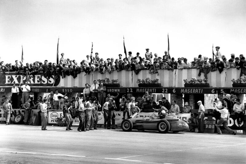 Jo Bonnier pulls into the pits in his Maserati 250F.