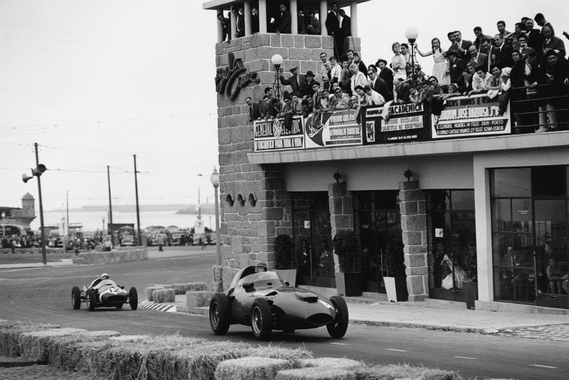 Tony Brooks driving a Vanwall VW5 leads Maurice Trintignant in his Cooper-Climax T45.