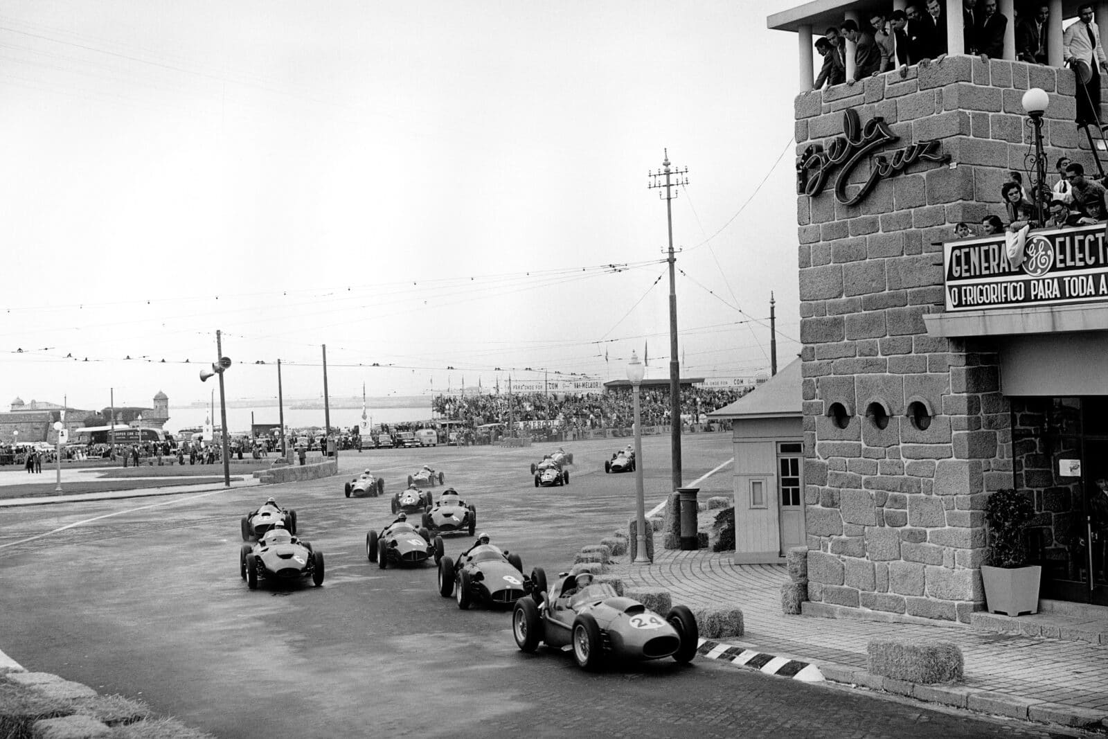 Mike Hawthorn (Ferrari Dino 246), leads Jean Behra (BRM P25) at the start of the race.